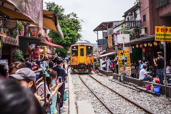 7-Hour Jiufen Night View, Shifen Waterfall & Raohe Market Tour - A 7-hour north Taiwan night-view loop from Taipei Main Station