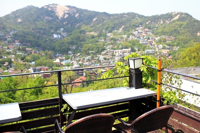 Full-Day Culinary Tour of Seoul Including Noryangjin Fish Market and Korean BBQ Dinner - Mt. Bukak coffee and the Bukak Pavilion pause