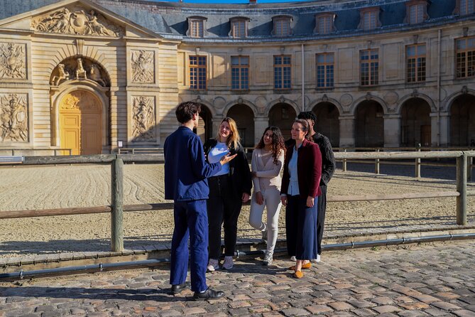 Versailles: Farmers Market & Royal Vegetable Garden Food Tour - Stop 1 on Rue de la Paroisse: le Cramique brioche and the church backdrop